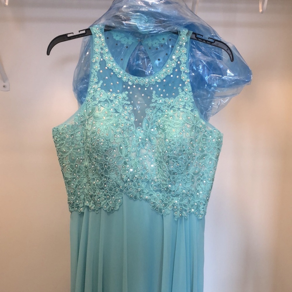 Mint green.  Beautiful dress!  Never worn!